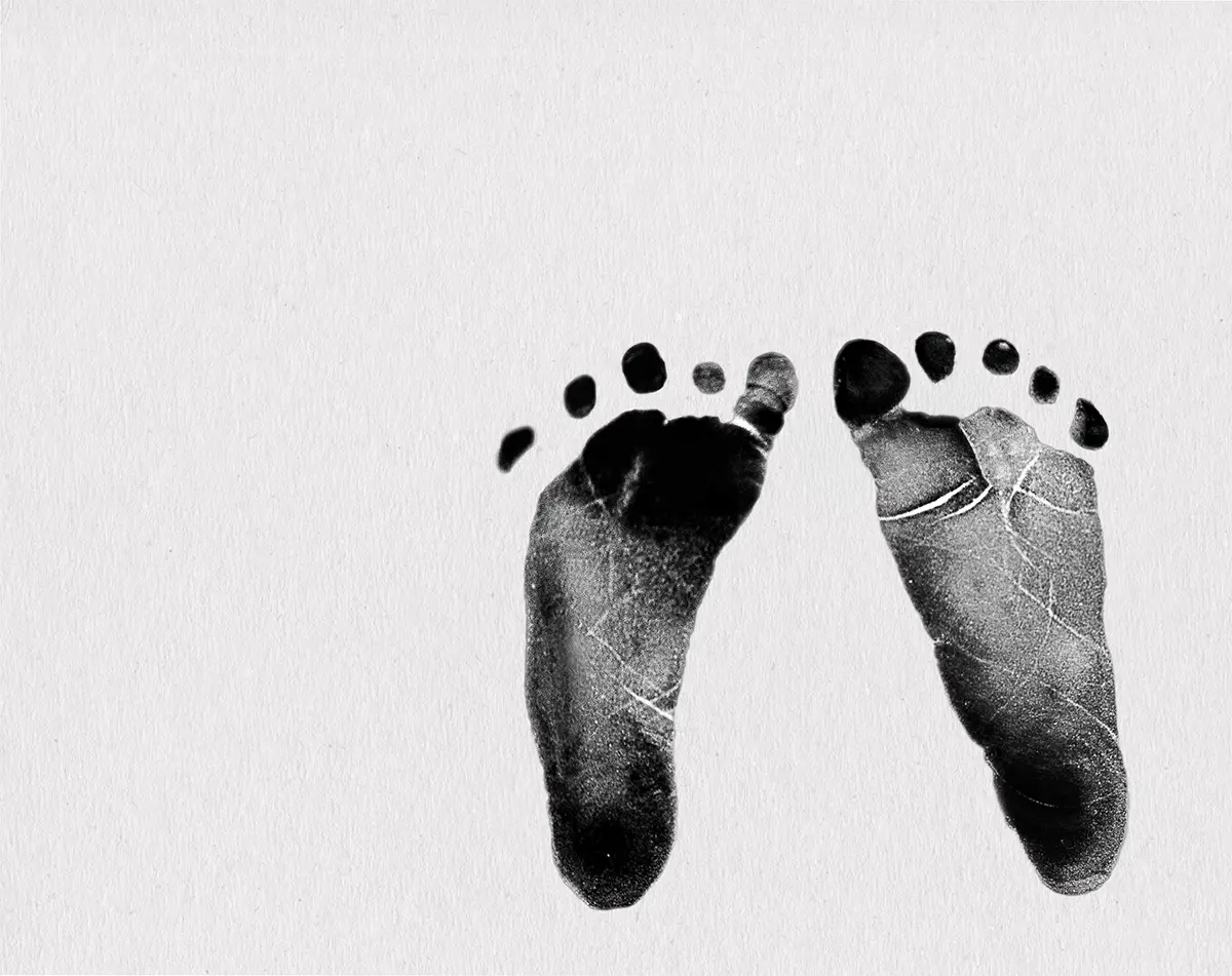 A pair of baby footprints on paper